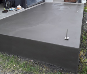 3kg black oxide concrete patio that has been stripped and trowelled