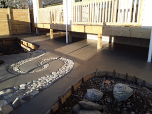 5kg Black oxide with Hand formed pebble water feature through concrete